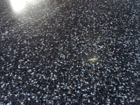 Close-up of black and white aggregate in a polished concrete floor